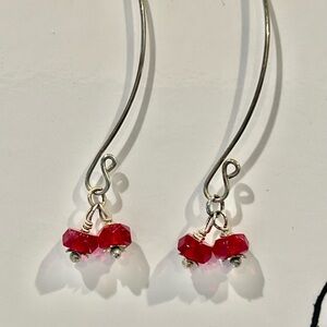 Large silver loops with faceted red crystals with flowers